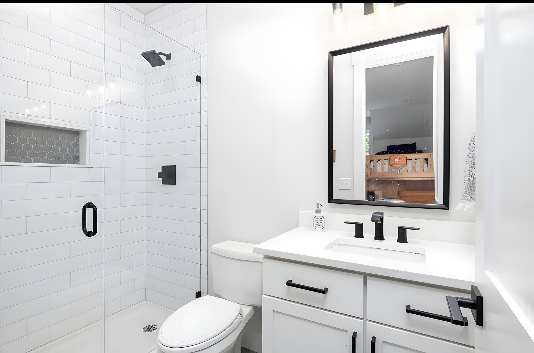 Guest bath with subway-tile shower and matte black fixtures